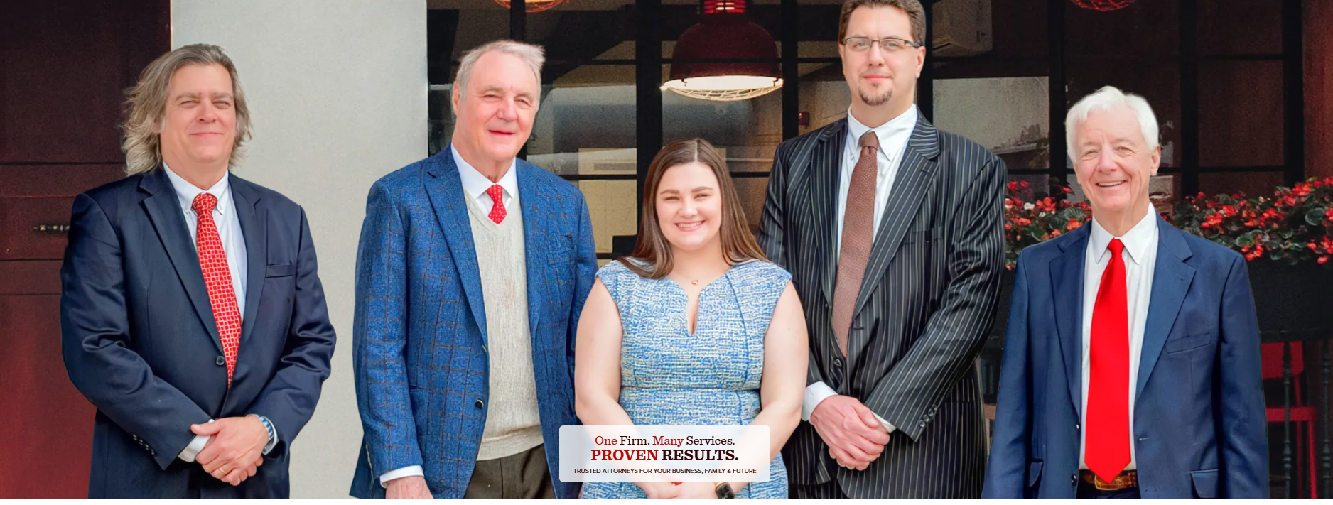 The attorneys of Johnston, Moore & Weston outside their Huntsville office